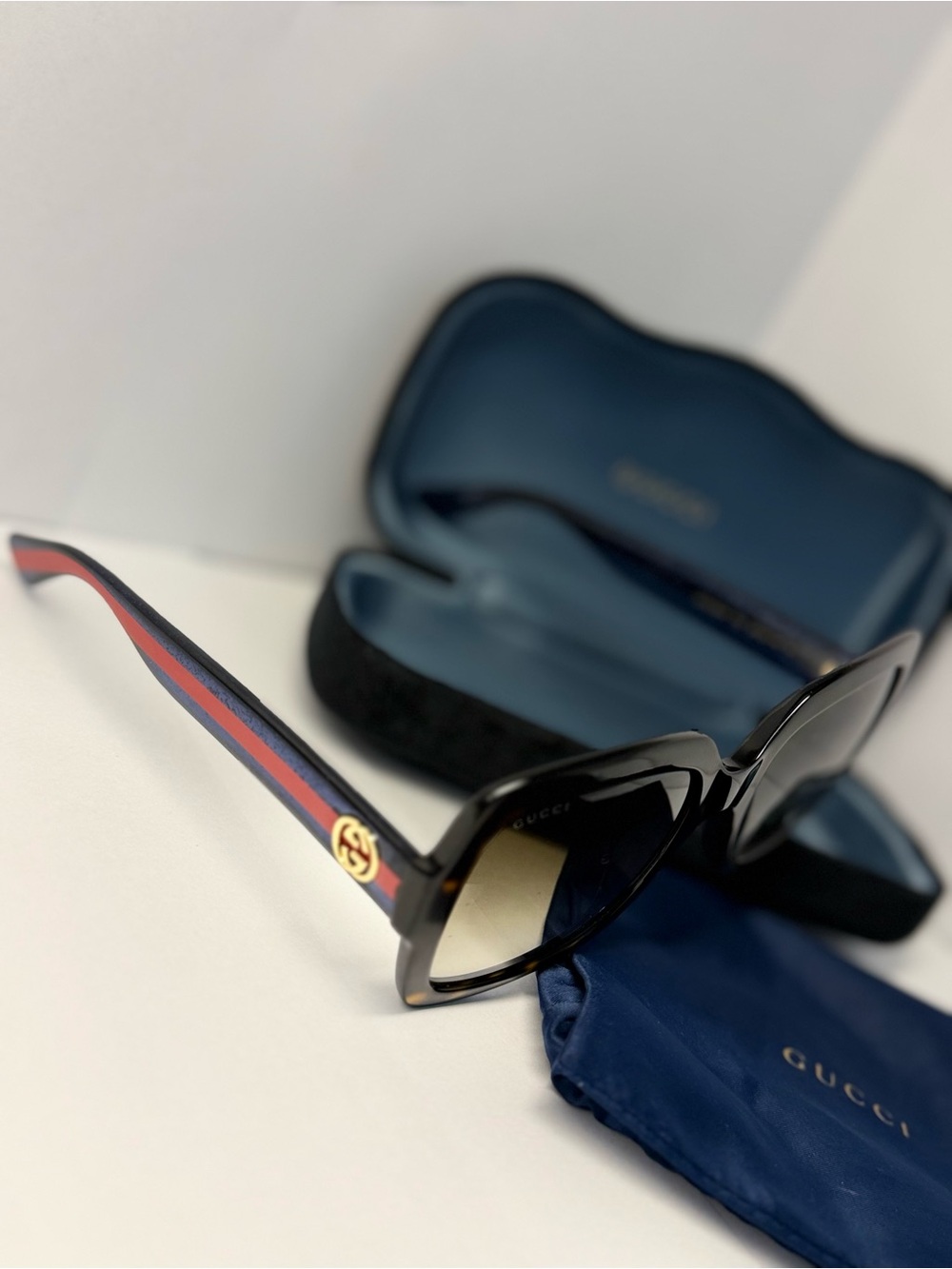 Gucci Black Sunglasses with Navy and Red Striped Temples